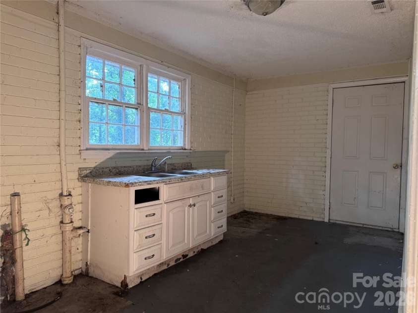 1713 White Store Road, Monroe, NC 28112.  MLS# CAR4425609, YatesRealty ID 51387. Laundry could be converted to an additional Bathroom/ Kitchenette