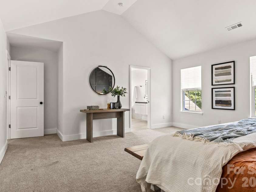 1153 Delander Lane, Charlotte, NC 28214.  MLS# CAR4424709, YatesRealty ID 51391. Cathedral ceiling primary bedroom