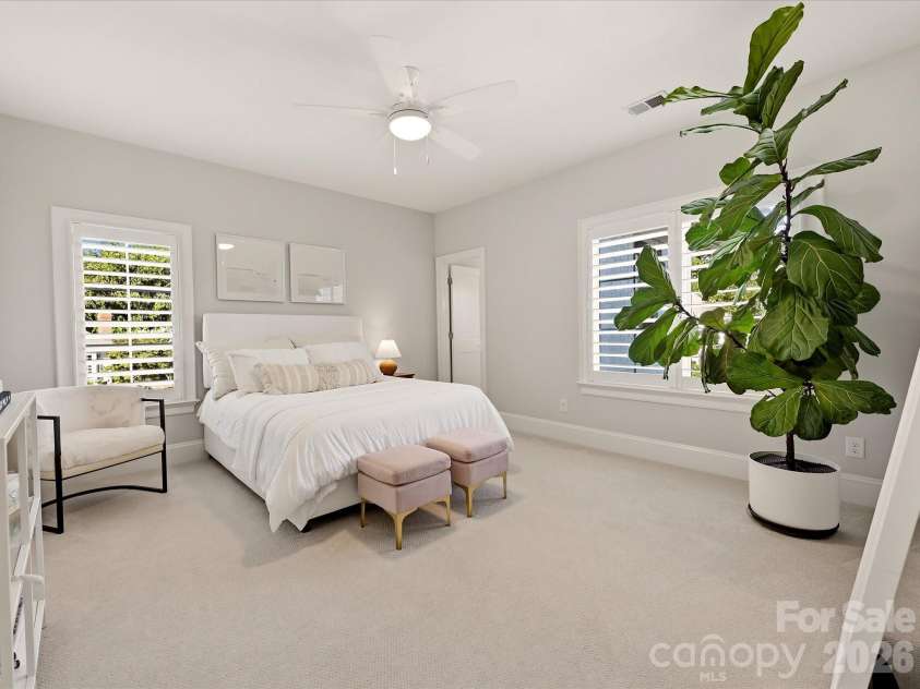 18717 Square Sail Road, Cornelius, NC 28031.  MLS# CAR4424933, YatesRealty ID 51420. Bedroom 3 offers a bright, spacious retreat with multiple windows, soft neutral finishes, and plenty of room for comfortable furnishings.