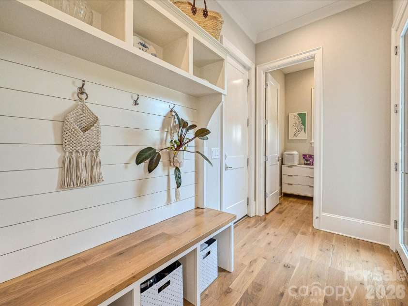18717 Square Sail Road, Cornelius, NC 28031.  MLS# CAR4424933, YatesRealty ID 51420. Functional drop zone features a built-in bench, open storage, and convenient hooks to keep everyday essentials organized and within easy reach.