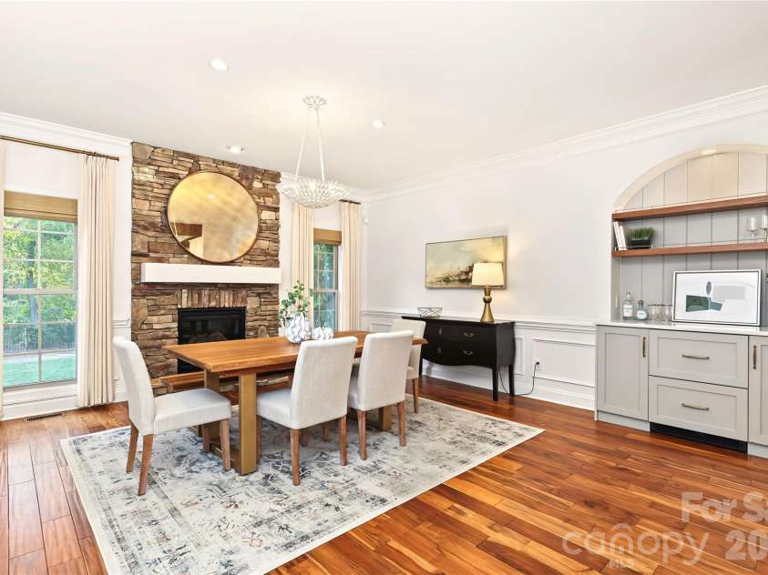 4934 Spalding Place, Charlotte, NC 28226.  MLS# CAR4423494, YatesRealty ID 51423. Dining Room with built-ins and a cozy fireplace.