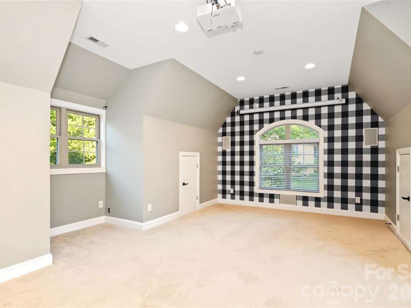 4934 Spalding Place, Charlotte, NC 28226.  MLS# CAR4423494, YatesRealty ID 51423. Large bedroom/bonus with projector and screen