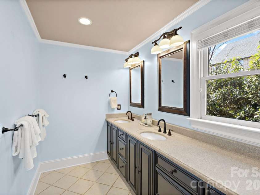 3016 Idlewood Circle, Charlotte, NC 28209.  MLS# CAR4357842, YatesRealty ID 5143. Primary bath with natural light and dual sinks.