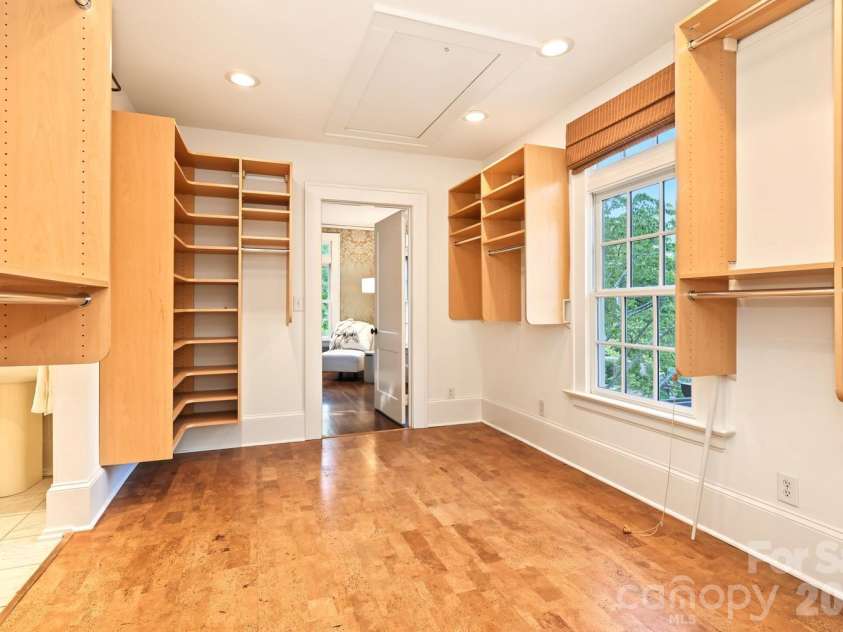 723 Berkeley Avenue, Charlotte, NC 28203.  MLS# CAR4422867, YatesRealty ID 51432. Large primary closet with custom built ins