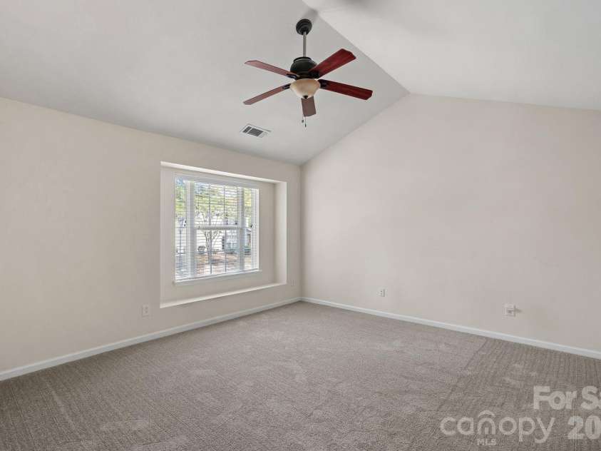 4717 Grier Farm Lane, Charlotte, NC 28270.  MLS# CAR4423441, YatesRealty ID 51445. Primary bedroom with vaulted ceilings