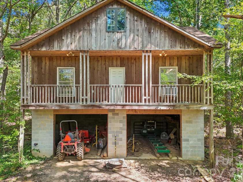2701 Cedar Trail Lane, Wingate, NC 28174.  MLS# CAR4422344, YatesRealty ID 51449. Secondary building with 2 car-garage and workshop on top.