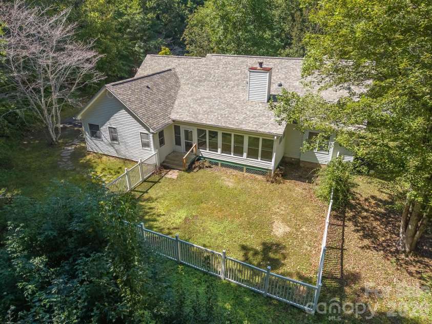 106 Fish Hawk Drive, Hendersonville, NC 28739.  MLS# CAR4425849, YatesRealty ID 51450. Drone of back yard
