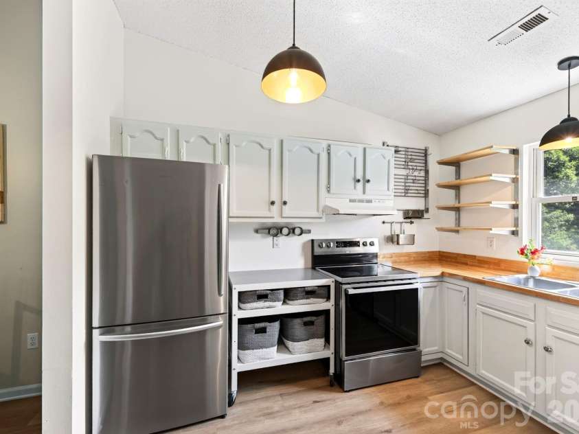 15 Krista Circle, Candler, NC 28715.  MLS# CAR4421478, YatesRealty ID 51466. Hisense refrigerator, range and dishwasher