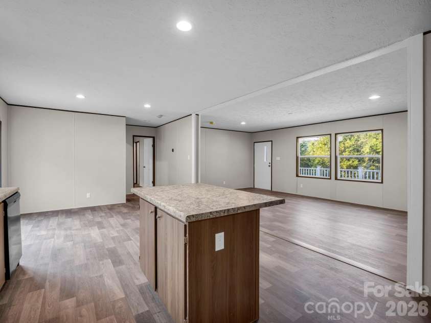 184 Crawford Hollow, Rutherfordton, NC 28139.  MLS# CAR4424597, YatesRealty ID 51486. Kitchen Opens to Dining/Living Room