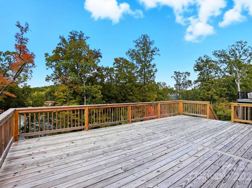 17909 Wilbanks Drive, Charlotte, NC 28278.  MLS# CAR4310693, YatesRealty ID 515. Take in the glorious lake views from your spacious deck, grill on the covered patio, enjoy fun boating adventures from your floating dock.
