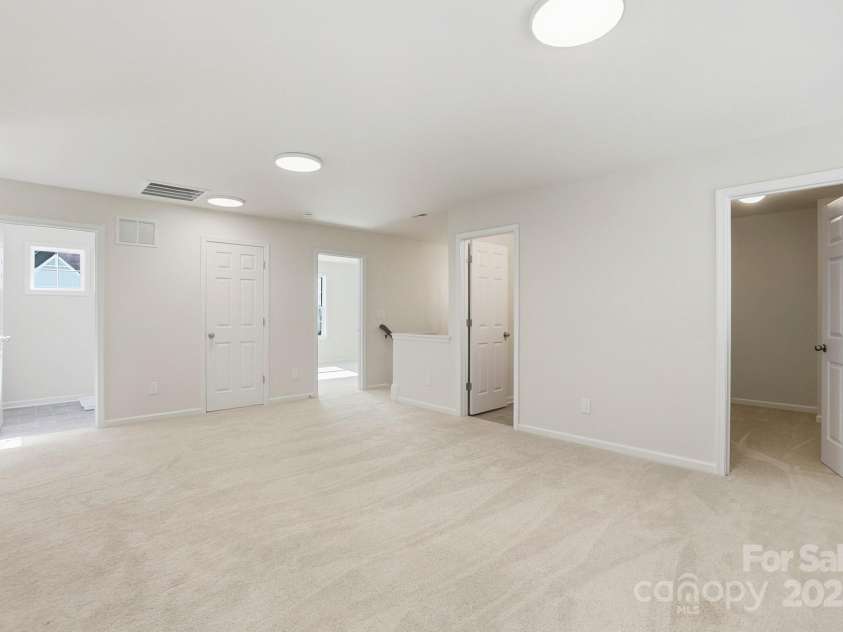 17909 Wilbanks Drive, Charlotte, NC 28278.  MLS# CAR4310693, YatesRealty ID 515. Upstairs, you’ll find three additional bedrooms, two full baths, and a versatile loft area—perfect for a home office, reading nook, or play space