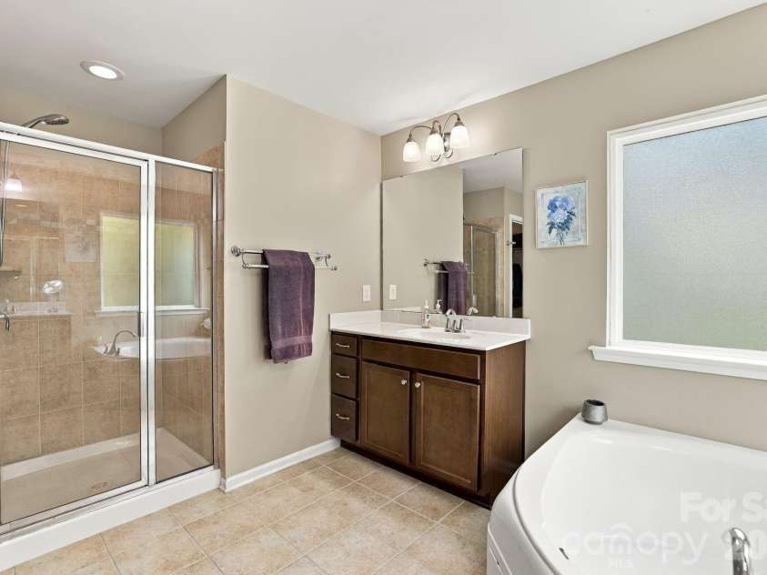 1236 Screech Owl Road, Waxhaw, NC 28173.  MLS# CAR4424430, YatesRealty ID 51502. Walk In Shower and Soaking Tub