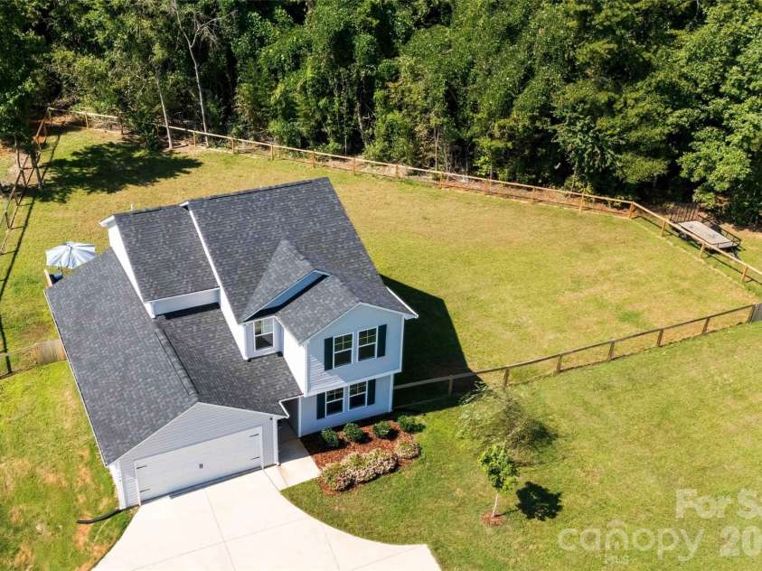 134 Cypress Lane, Linwood, NC 27299.  MLS# CAR4424091, YatesRealty ID 51510. Backs up to tree line for privacy