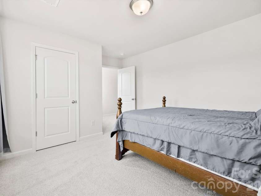 134 Cypress Lane, Linwood, NC 27299.  MLS# CAR4424091, YatesRealty ID 51510. Bedroom 2 with walk in closet