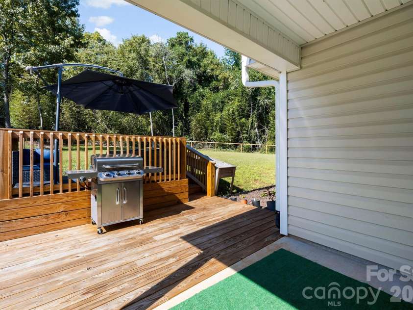 134 Cypress Lane, Linwood, NC 27299.  MLS# CAR4424091, YatesRealty ID 51510. Covered patio plus a deck for more seating