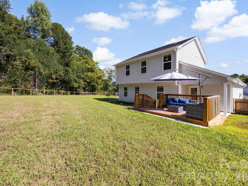 134 Cypress Lane, Linwood, NC 27299.  MLS# CAR4424091, YatesRealty ID 51510. Covered patio plus deck area in back yard