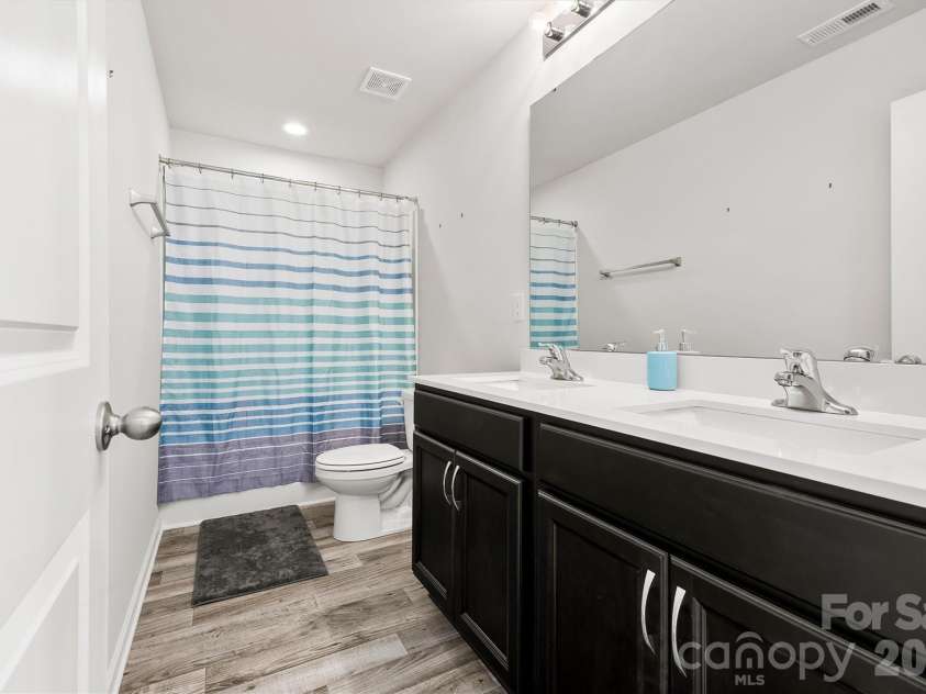 134 Cypress Lane, Linwood, NC 27299.  MLS# CAR4424091, YatesRealty ID 51510. Double sinks in hallway bathroom