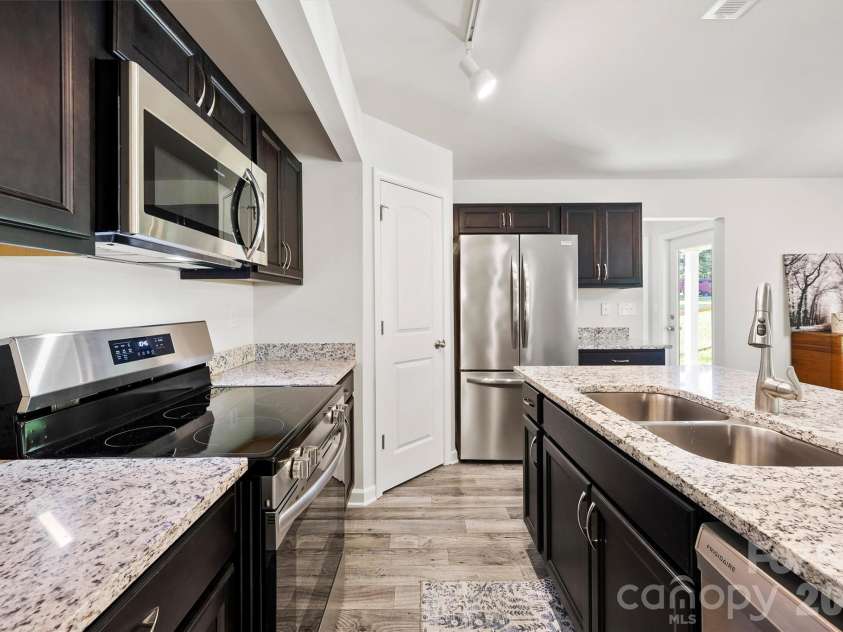 134 Cypress Lane, Linwood, NC 27299.  MLS# CAR4424091, YatesRealty ID 51510. Like new kitchen with granite counter tops