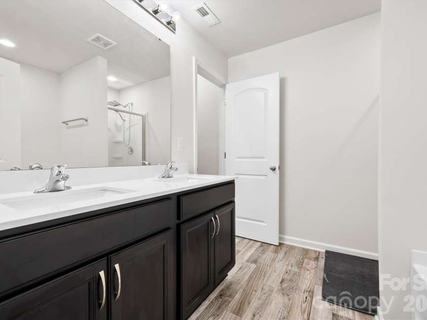 134 Cypress Lane, Linwood, NC 27299.  MLS# CAR4424091, YatesRealty ID 51510. Primary suite with double sinks