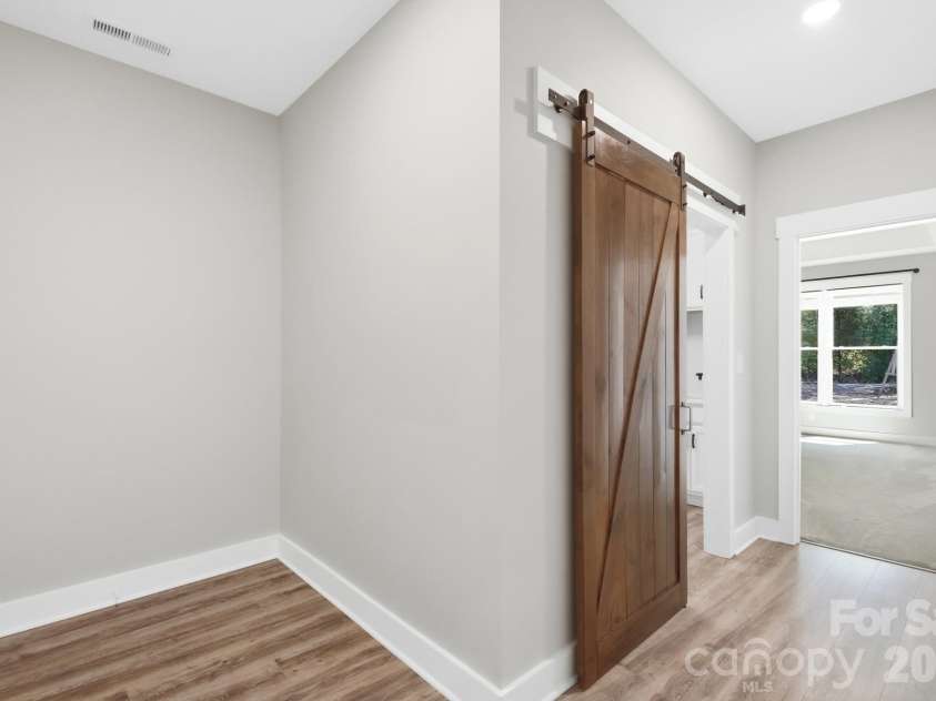 5115 Waxhaw Highway, Monroe, NC 28112.  MLS# CAR4424543, YatesRealty ID 51514. Drop Zone and Barn Door to the Laundry