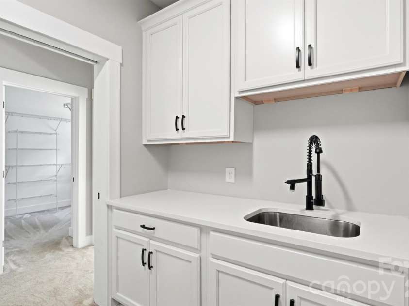 5115 Waxhaw Highway, Monroe, NC 28112.  MLS# CAR4424543, YatesRealty ID 51514. Huge Laundry Room access to Primary Suite