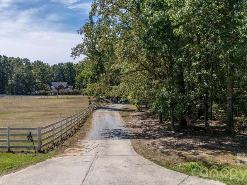 1517 Helms Short Cut Road, Monroe, NC 28112.  MLS# CAR4424290, YatesRealty ID 51519. Long Drive way into property offers privacy