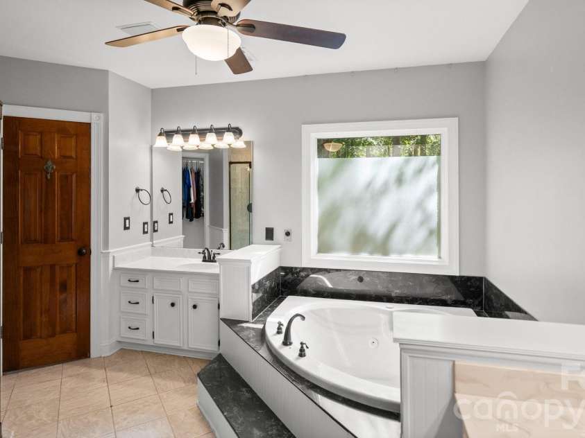 1517 Helms Short Cut Road, Monroe, NC 28112.  MLS# CAR4424290, YatesRealty ID 51519. Primary bath with two vanities