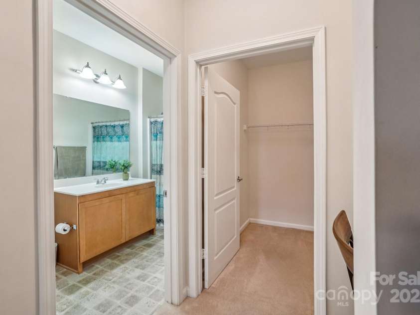 316 Appeldoorn Circle, Asheville, NC 28803.  MLS# CAR4316997, YatesRealty ID 51520. Walk in closet and primary bathroom