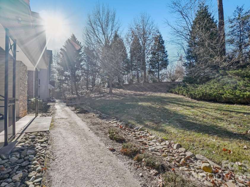 316 Appeldoorn Circle, Asheville, NC 28803.  MLS# CAR4316997, YatesRealty ID 51520. Walking trail and green space outside of back patio