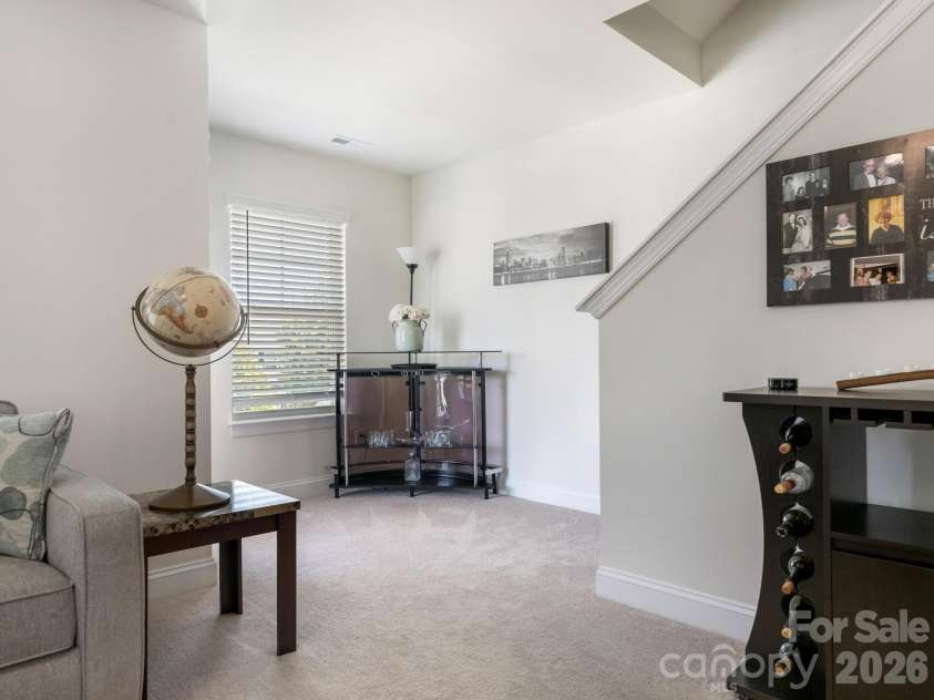 6008 Hampstead Pond Lane, Charlotte, NC 28105.  MLS# CAR4419795, YatesRealty ID 51529. Second level loft den facing stairs to third level