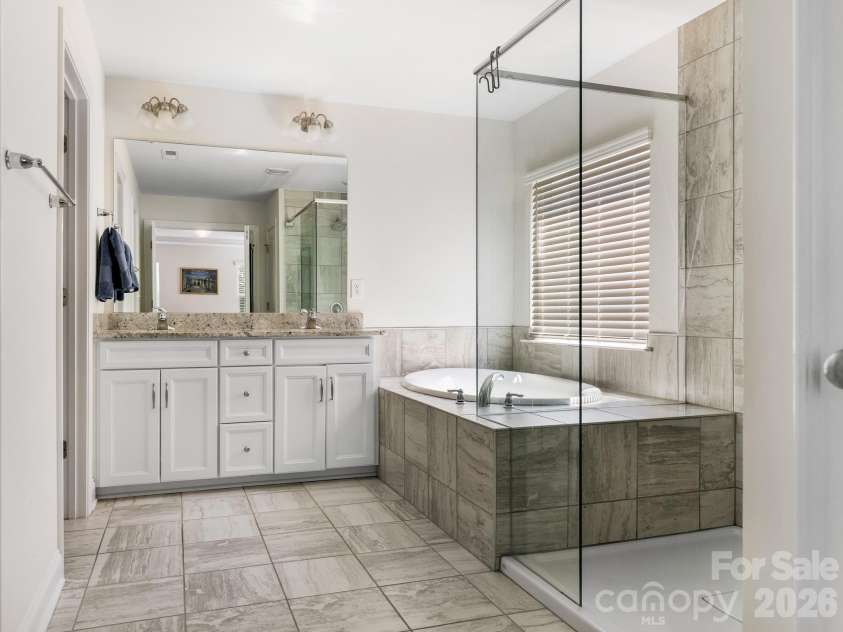 6008 Hampstead Pond Lane, Charlotte, NC 28105.  MLS# CAR4419795, YatesRealty ID 51529. Spacious and luxurious Owner's bathroom