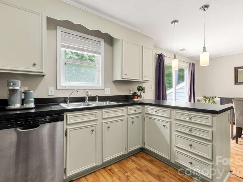 11218 Mallard Crossing Drive, Charlotte, NC 28262.  MLS# CAR4425577, YatesRealty ID 51530. Another view of Kitchen looking towards Dining
