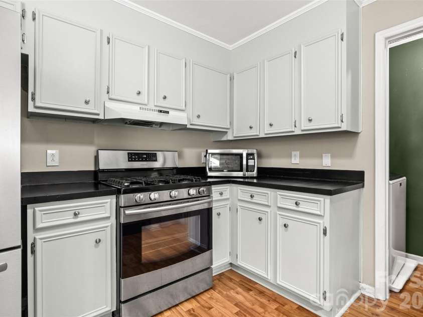 11218 Mallard Crossing Drive, Charlotte, NC 28262.  MLS# CAR4425577, YatesRealty ID 51530. Bright kitchen has refinished cabinets