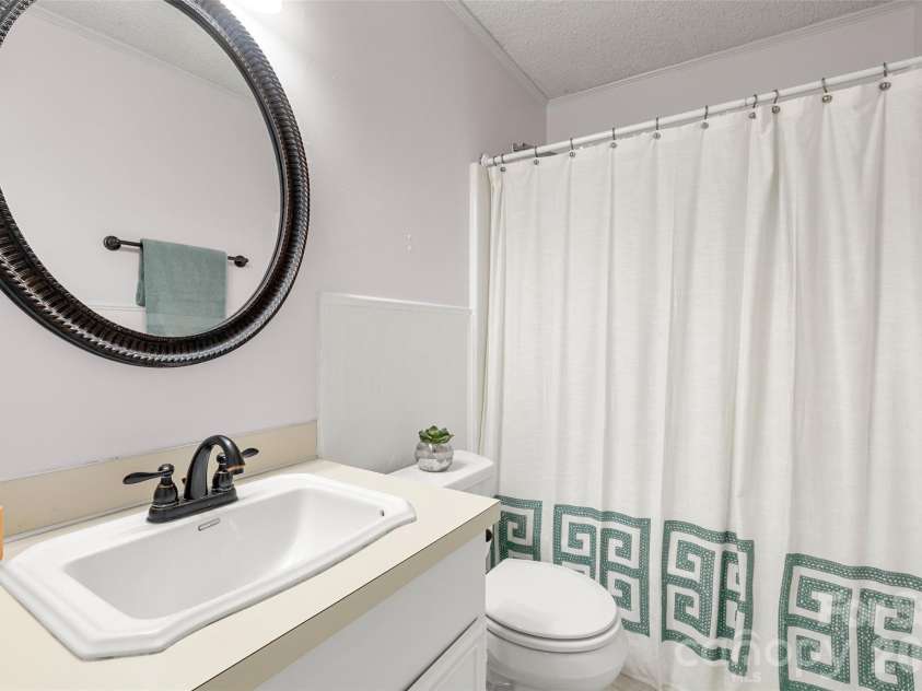 11218 Mallard Crossing Drive, Charlotte, NC 28262.  MLS# CAR4425577, YatesRealty ID 51530. Secondary bath in hall