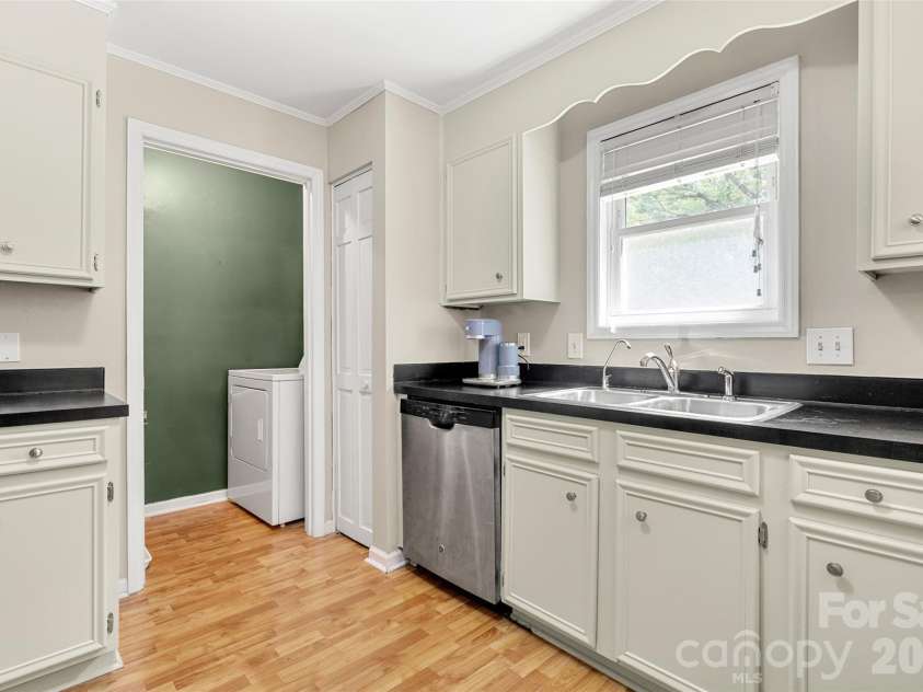 11218 Mallard Crossing Drive, Charlotte, NC 28262.  MLS# CAR4425577, YatesRealty ID 51530. Walk through kitchen to get to Laundry room