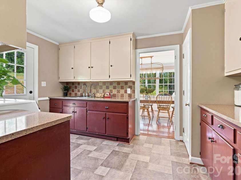 1732 Paul Payne Store Road, Taylorsville, NC 28681.  MLS# CAR4425907, YatesRealty ID 51541. Main Level Pantry & Laundry Room/Dining Entry View