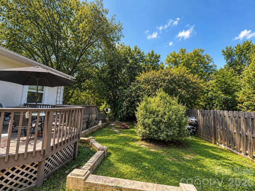 4711 Summit Avenue, Greensboro, NC 27405.  MLS# CAR4425186, YatesRealty ID 51545. Backyard Deck and Garden
