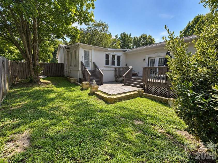 4711 Summit Avenue, Greensboro, NC 27405.  MLS# CAR4425186, YatesRealty ID 51545. Backyard Deck and Garden Retreat