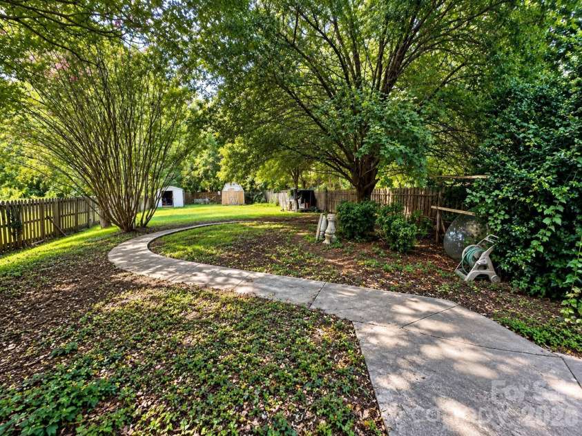 4711 Summit Avenue, Greensboro, NC 27405.  MLS# CAR4425186, YatesRealty ID 51545. Tranquil Curved Pathway Garden