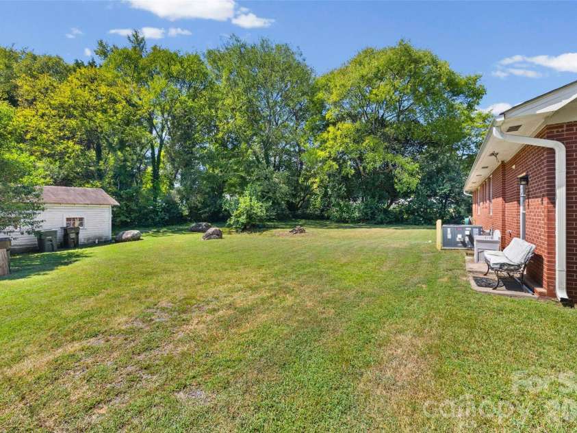 610 Union Cemetery Road, Concord, NC 28027.  MLS# CAR4425181, YatesRealty ID 51549. Side Yard