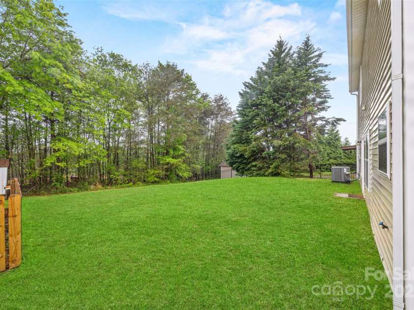 3725 Catawba Creek Drive, Gastonia, NC 28056.  MLS# CAR4240950, YatesRealty ID 5155. Backyard abuts wooded area