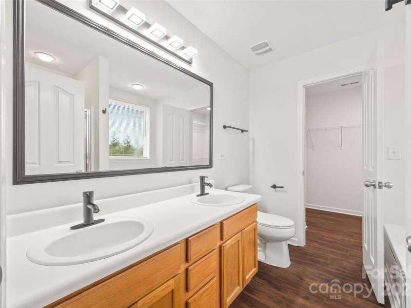 3725 Catawba Creek Drive, Gastonia, NC 28056.  MLS# CAR4240950, YatesRealty ID 5155. Double sinks in suite's bathroom