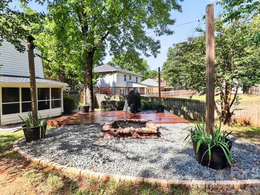 10743 Osprey Drive, Charlotte, NC 28226.  MLS# CAR4425593, YatesRealty ID 51555. Firepit and deck for entertaining.