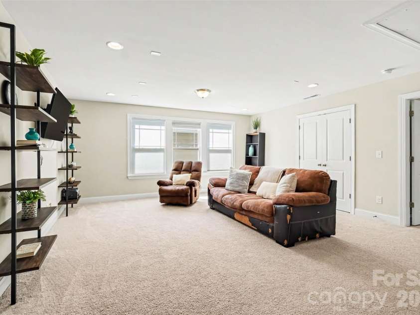 149 Longleaf Drive, Mooresville, NC 28117.  MLS# CAR4424546, YatesRealty ID 51571. Loft with shelving system that will convey.
