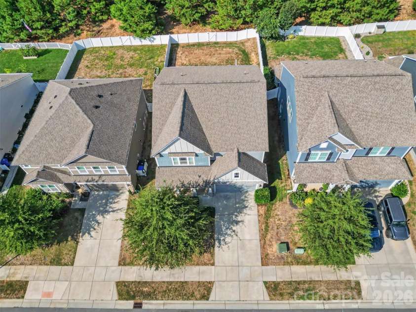 149 Longleaf Drive, Mooresville, NC 28117.  MLS# CAR4424546, YatesRealty ID 51571. Private and level backyard. Evergreen trees offer a beautiful back drop.