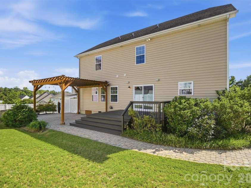 10038 Travertine Trail, Davidson, NC 28036.  MLS# CAR4424425, YatesRealty ID 51572. Back of Home