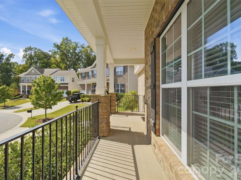 10038 Travertine Trail, Davidson, NC 28036.  MLS# CAR4424425, YatesRealty ID 51572. Elevated Covered Porch