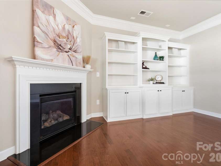 10038 Travertine Trail, Davidson, NC 28036.  MLS# CAR4424425, YatesRealty ID 51572. Living Room with High End Built-In Casework.