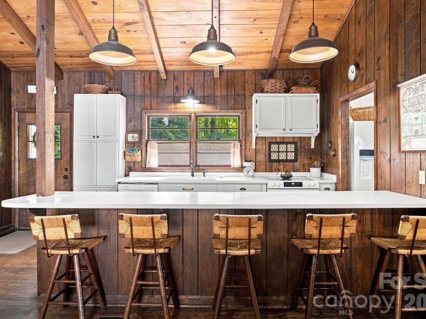 4036 Rhynland Drive, Sherrills Ford, NC 28673.  MLS# CAR4425140, YatesRealty ID 51577. Extended bar seating where everyone gathers