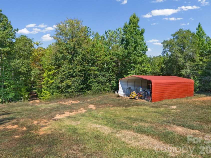 4329 Wylies Mill Road, Edgemoor, SC 29712.  MLS# CAR4424533, YatesRealty ID 51580. Additional Carport behind workshop